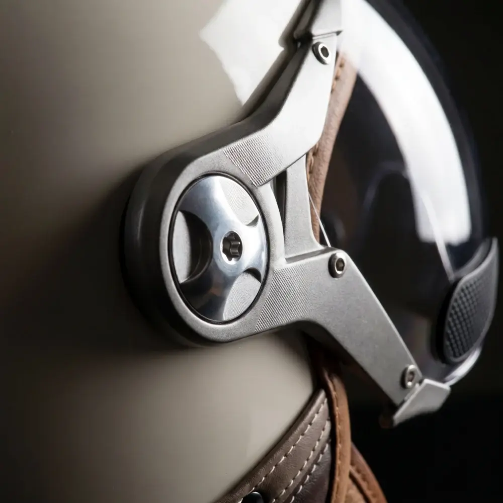 Close view of the visor fixing on a cream SOXON SP-325 Urban helmet